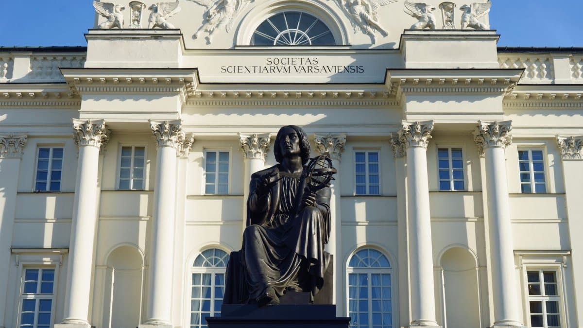 View of Nicolaus Copernicus statue in front of the Warsaw Scientific Society building.