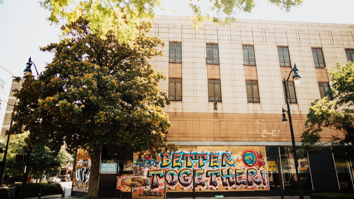 Colorful graffiti mural 'Better Together' on urban building facade in Birmingham, AL.