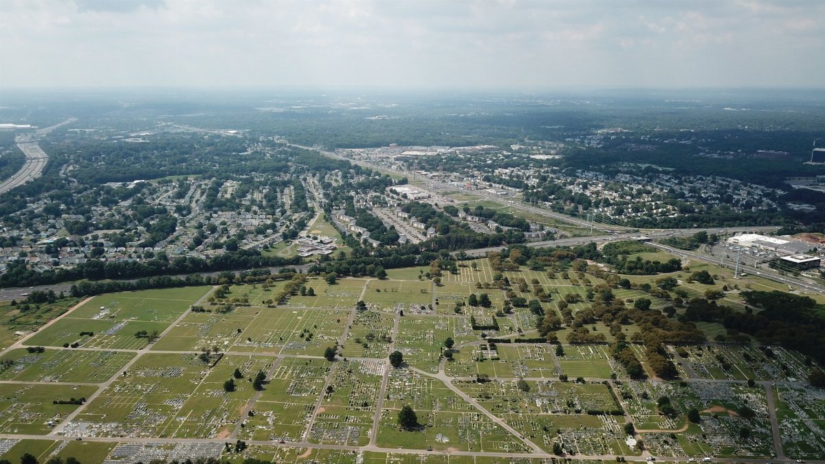 Aerial view showcasing the landscape of Woodbridge Township, NJ, with fields and residential areas.