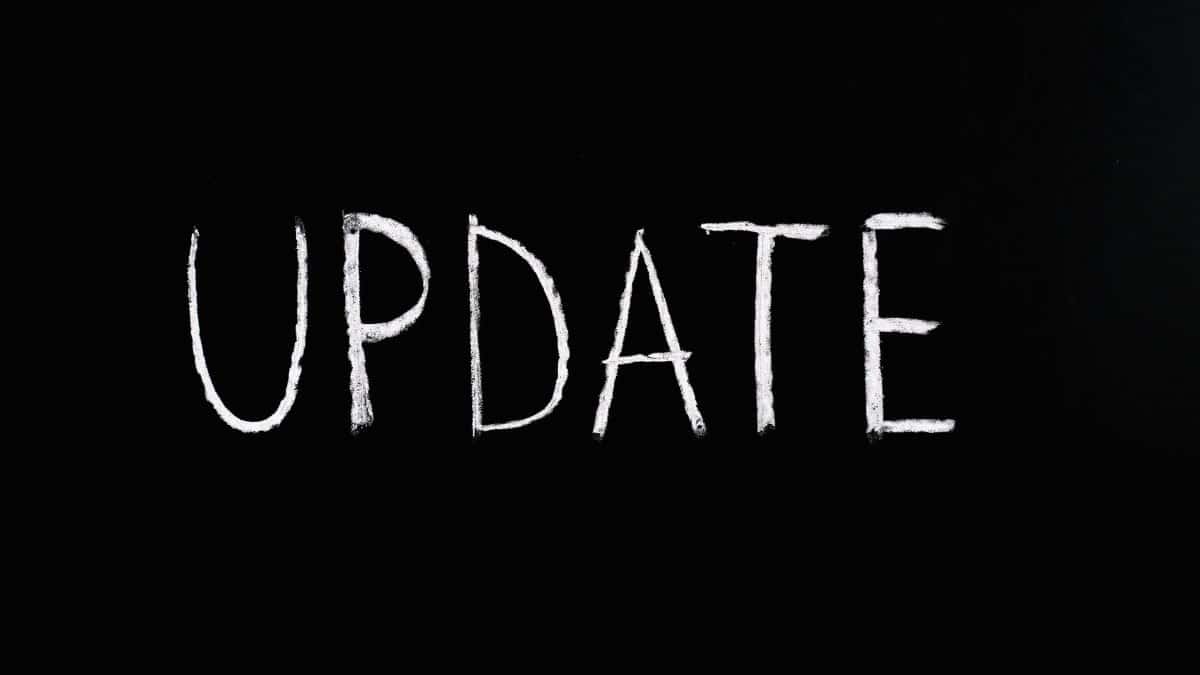 Bold 'UPDATE' text written in chalk on a blackboard. Perfect for concepts of change and communication.