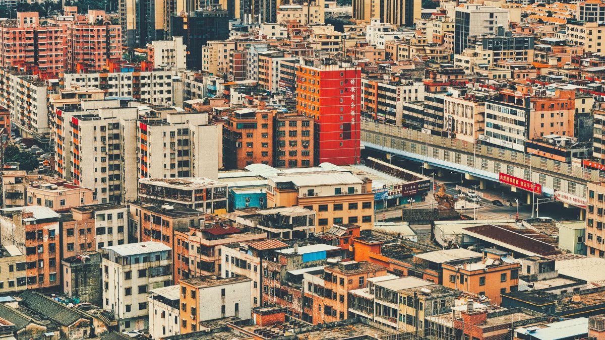 Aerial view of the densely packed buildings in Dongguan, China showcasing the urban density and architecture.