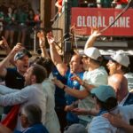 Excited sports fans celebrating a victory at an outdoor Chicago event, embodying joy and enthusiasm.