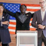 A group of diverse individuals standing confidently in front of an American flag at an election podium.
