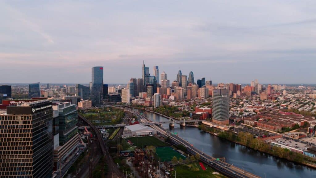 A stunning aerial view of the Philadelphia skyline with clear skies, capturing the cityscape and urban development.