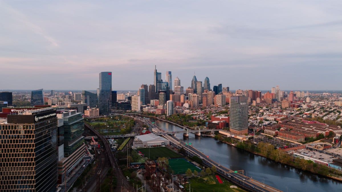 A stunning aerial view of the Philadelphia skyline with clear skies, capturing the cityscape and urban development.