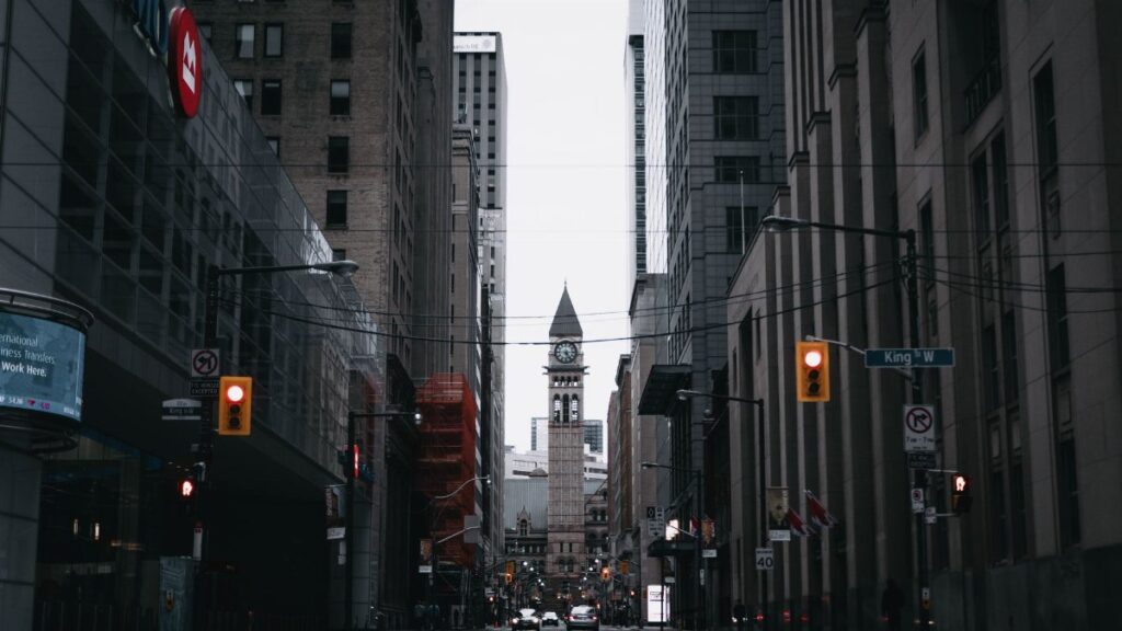 Capture of Toronto's urban street with the historic Old City Hall clock tower.