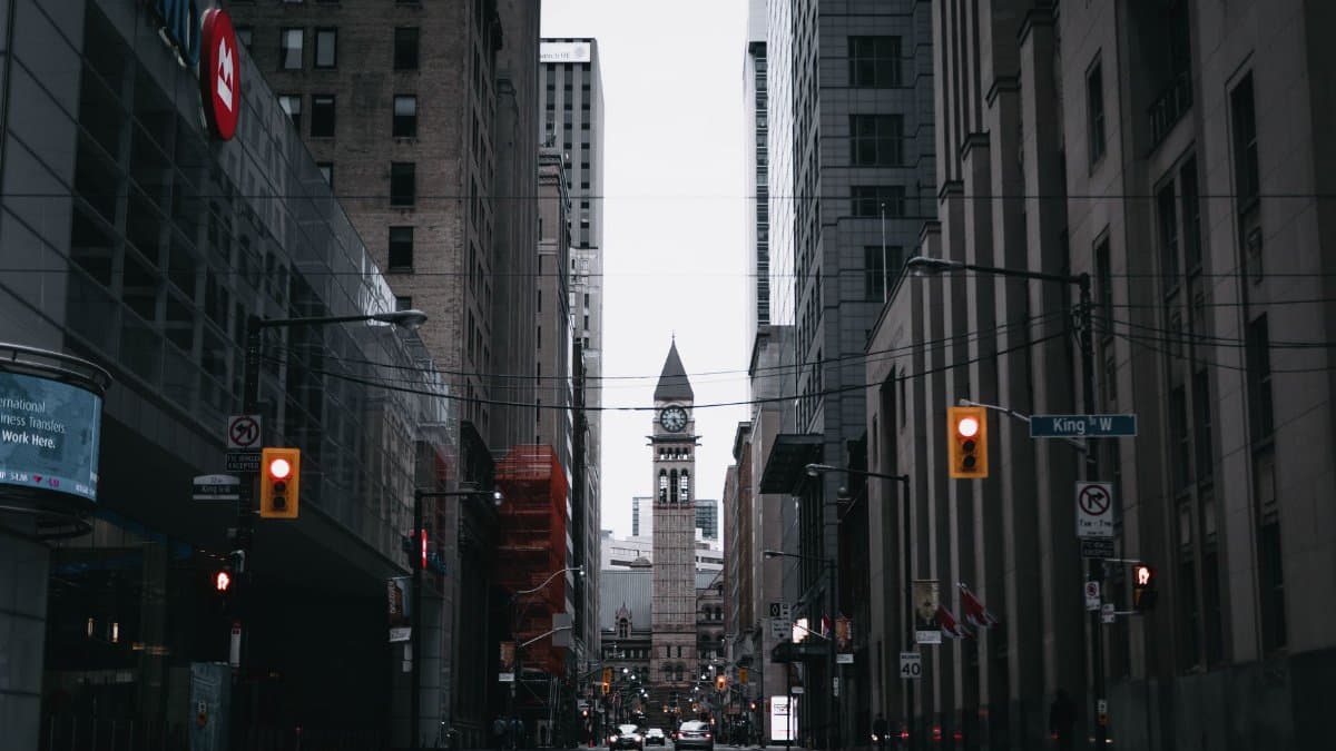 Capture of Toronto's urban street with the historic Old City Hall clock tower.