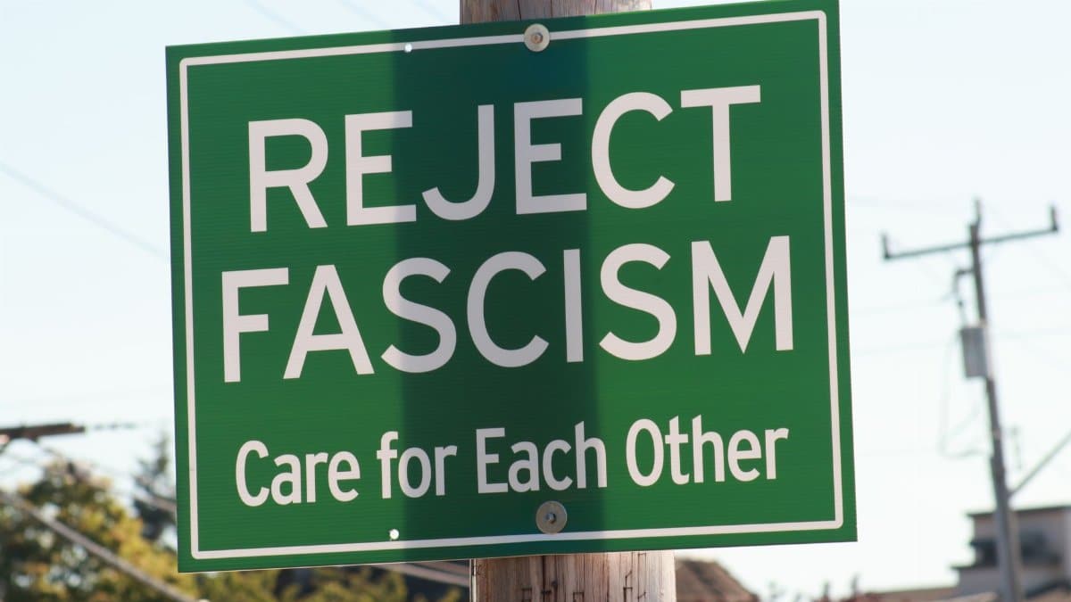 A green sign in Seattle promoting anti-fascism and community care.