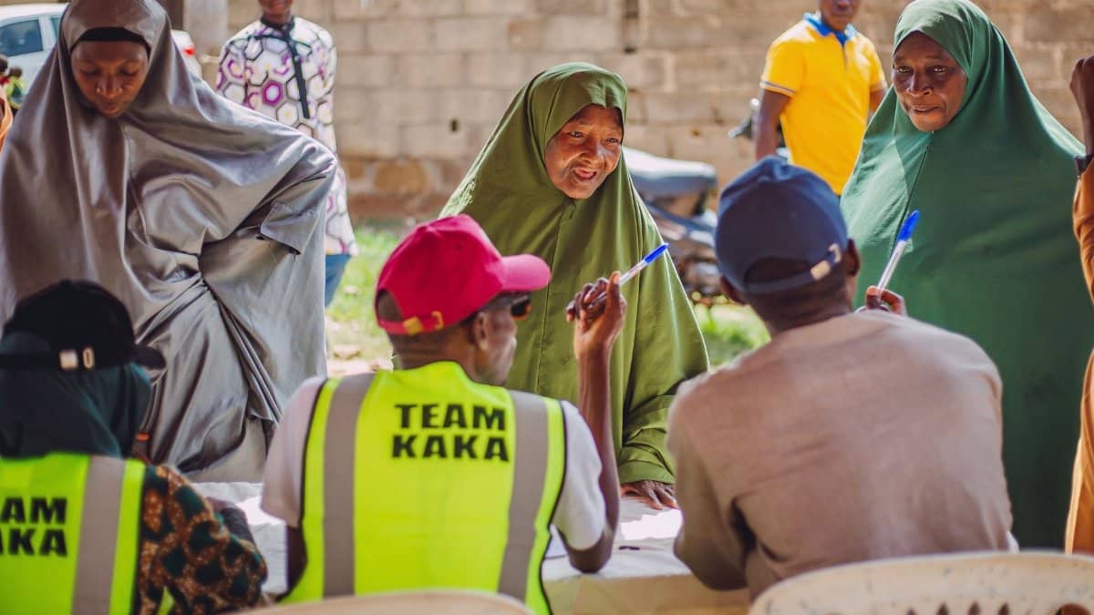 A vibrant community meeting in Kaduna, Nigeria, highlighting engagement and collaboration.
