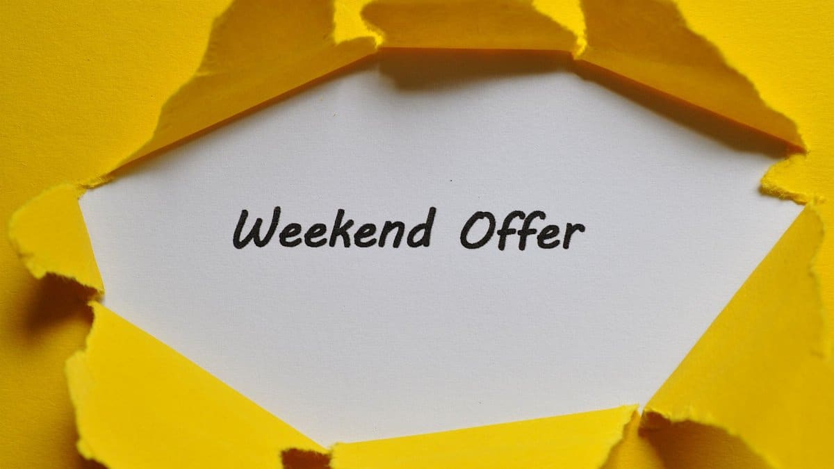 Yellow torn paper uncovering 'Weekend Offer' text. Ideal for promotions.