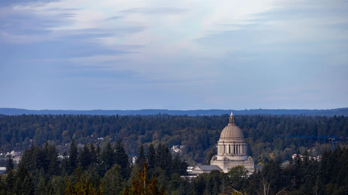 View of Washington State Capitol amidst lush forests in Olympia, Washington.