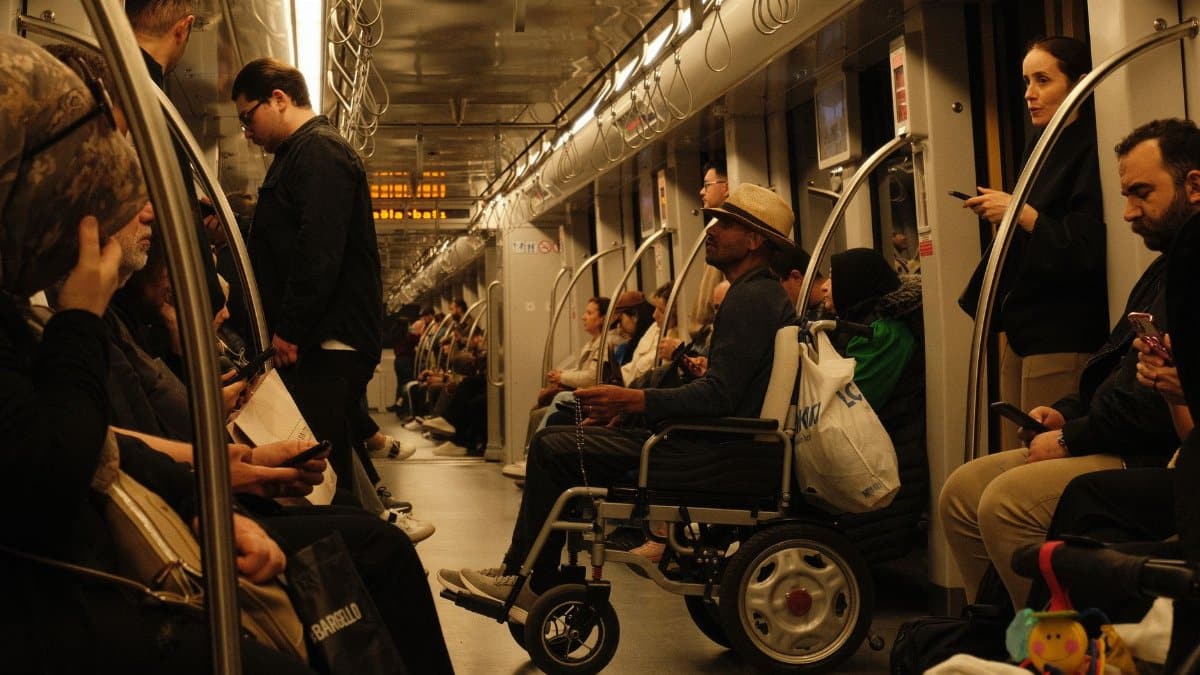 A multitude of passengers on a crowded subway train, showcasing urban daily life.