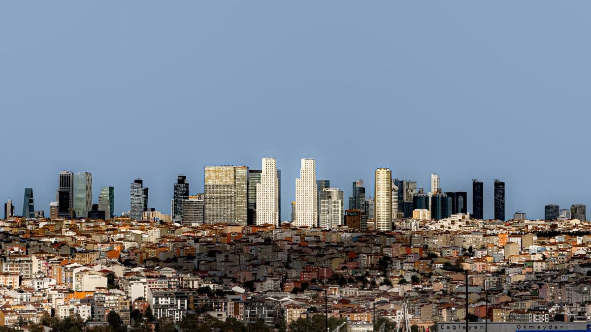 A panoramic view of Istanbul's skyline showcasing modern skyscrapers under a clear blue sky.