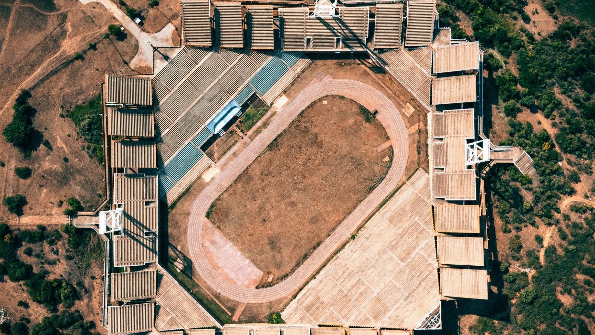 Explore the stunning aerial capture of Mmabatho Stadium in South Africa, showcasing its distinctive architecture.