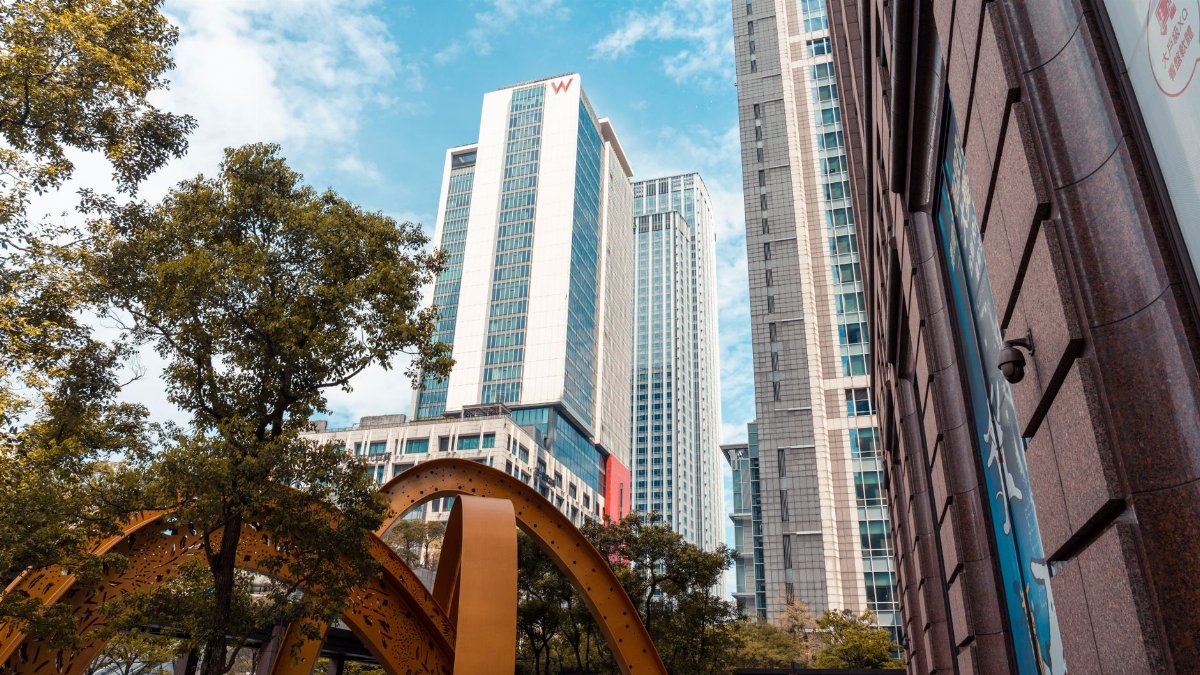 Low-angle shot of modern skyscrapers and architectural features in Taipei, Taiwan.