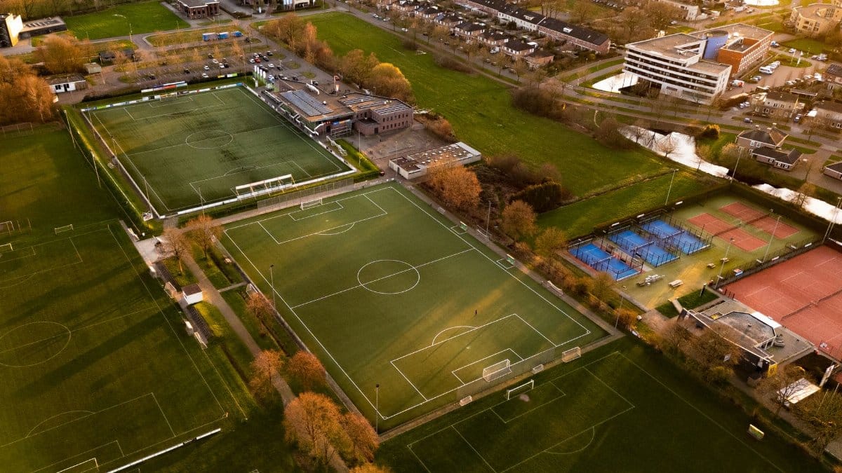 Aerial shot of sports fields and courts in Hoogeveen, Nederland at sunset.