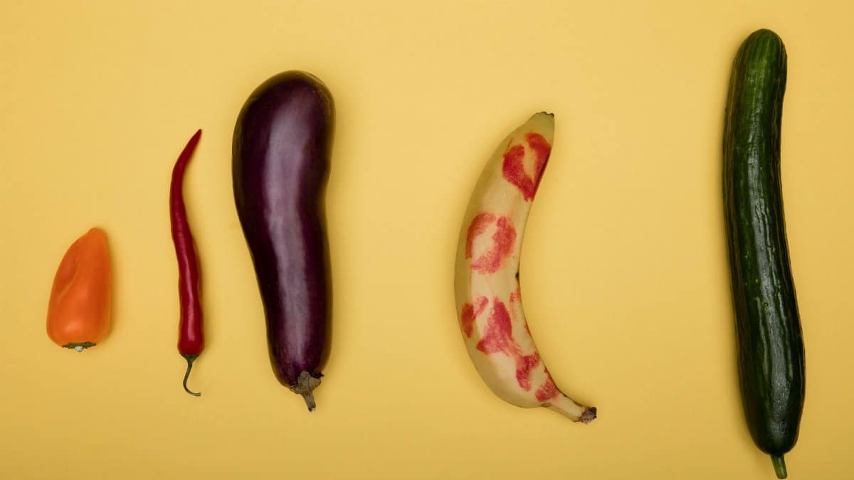 Vibrant assortment of fruits and vegetables on a yellow backdrop.
