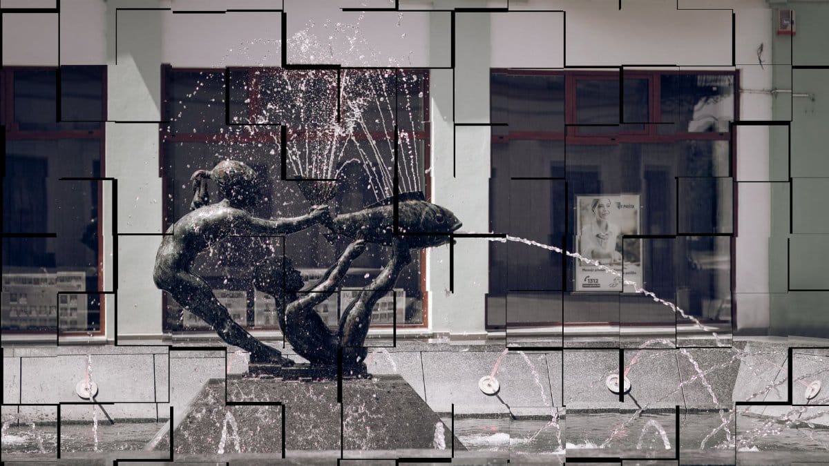 A modern fountain sculpture splashing water in an urban street, Brčko, Bosnia and Herzegovina.