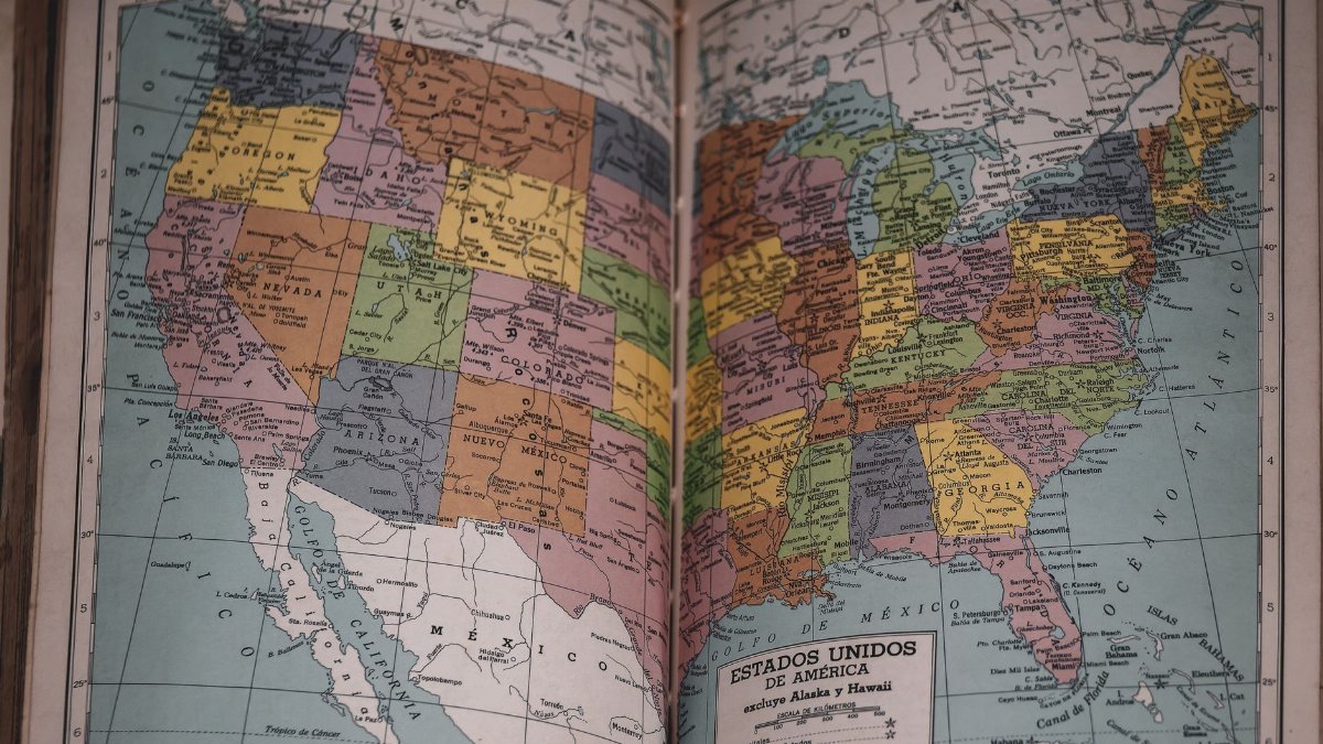 Classic vintage map of the United States in a historical book, showcasing detailed state borders.