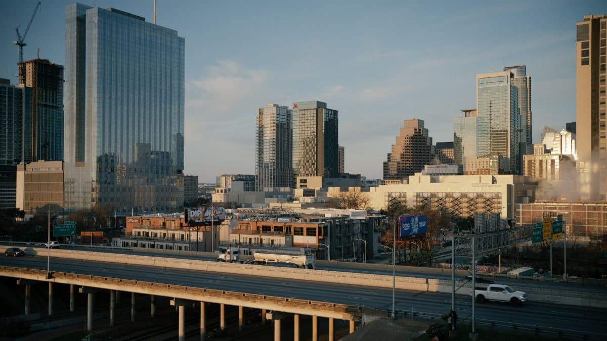 Aerial view of downtown Austin, Texas showcasing modern skyscrapers and urban infrastructure at dusk.
