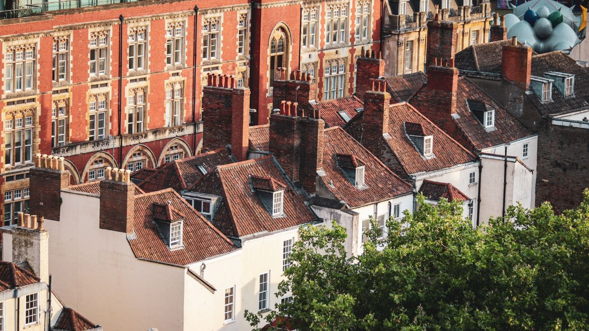 Aerial view of charming rooftops and historic architecture in Bristol, UK.