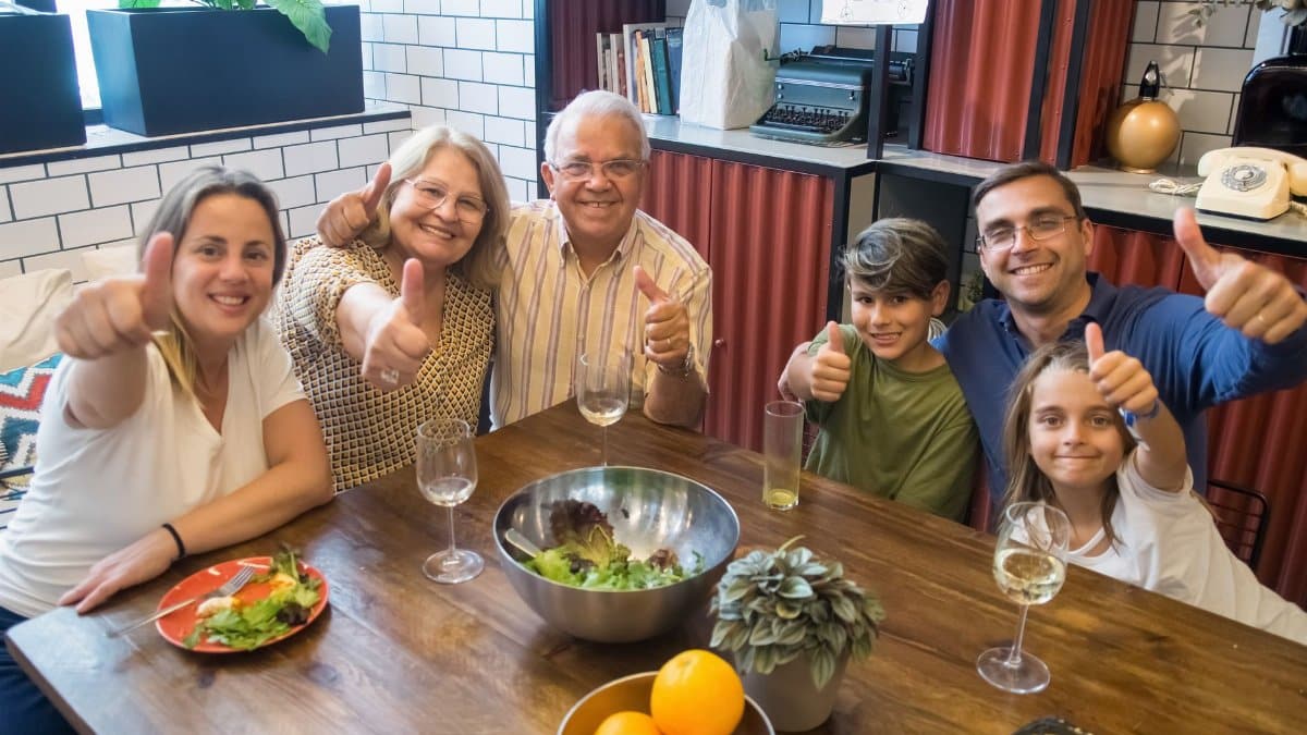 A happy family enjoying a meal together, showcasing togetherness and joy at a dining table.