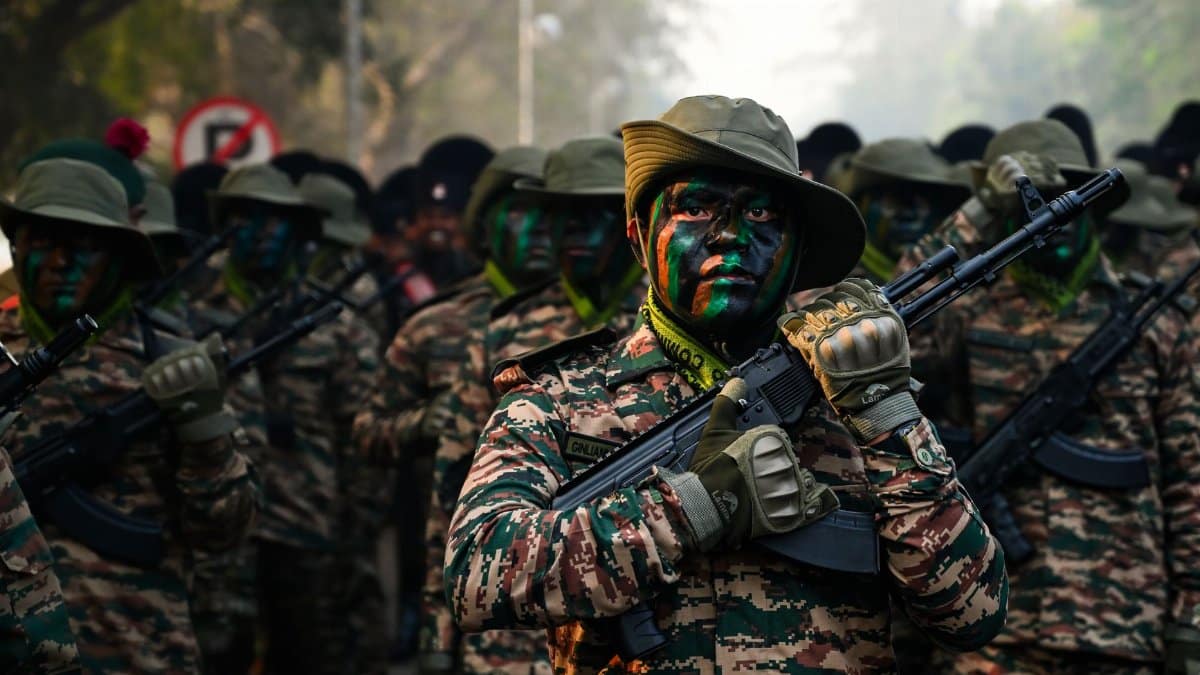 Camouflaged soldiers in India participating in a military parade, showcasing readiness and discipline.