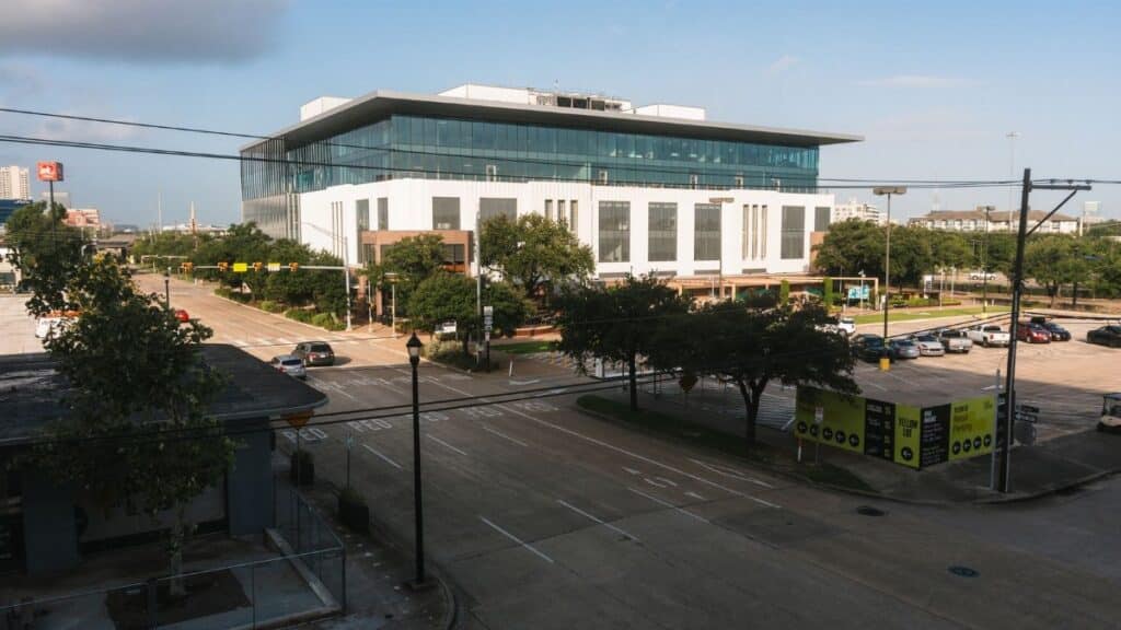 Daytime view of a modern office building in downtown Houston, Texas.