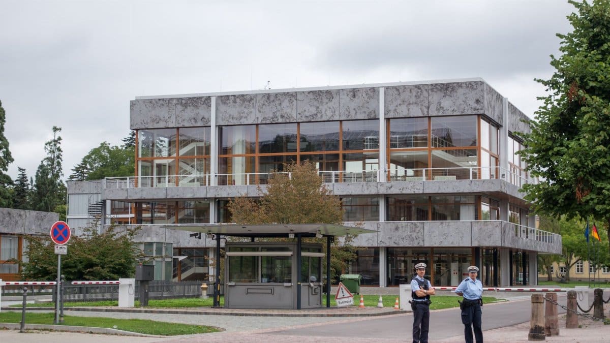 Modern building exterior in Karlsruhe, Germany, with security presence.
