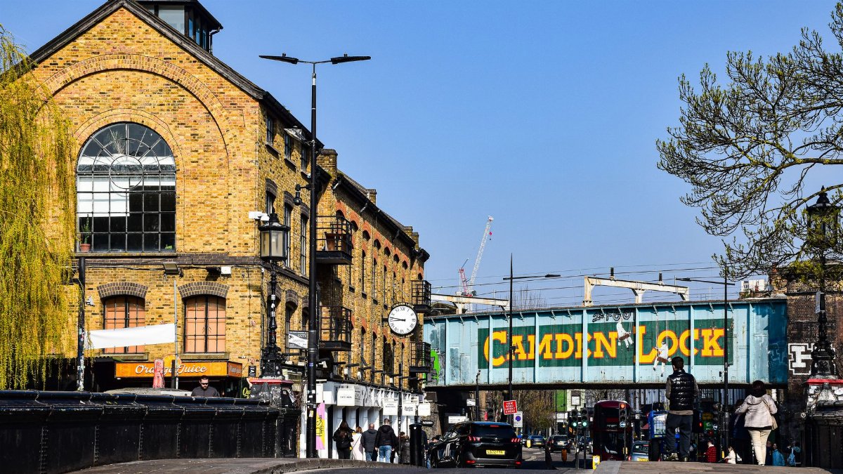 Explore the lively Camden Lock Market with historic architecture and bustling city atmosphere in London.