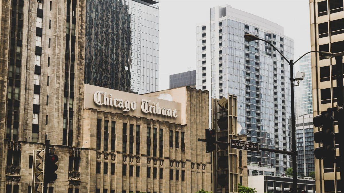 Chicago Tribune Tower with surrounding modern skyscrapers in downtown Chicago.