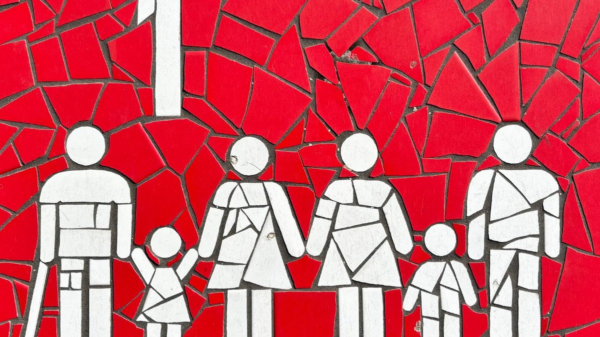 Colorful mosaic artwork depicting a family on a vibrant red backdrop, symbolizing unity and diversity.