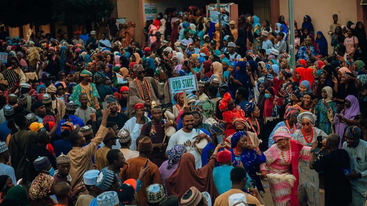 Vibrant cultural festival crowd in Oyo State, Nigeria celebrating tradition.