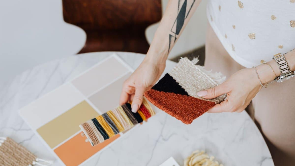 Close-up of fabric samples with color swatches for interior design.