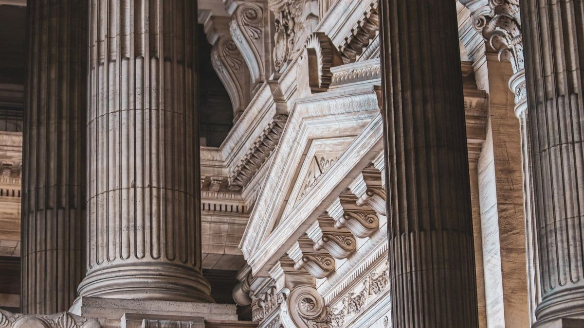 Intricate neoclassical architecture with prominent columns and ornate details.