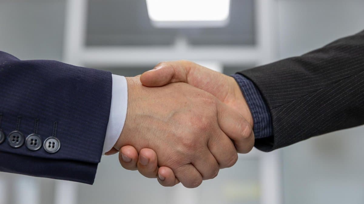 Close-up of a business handshake representing a successful partnership or agreement.