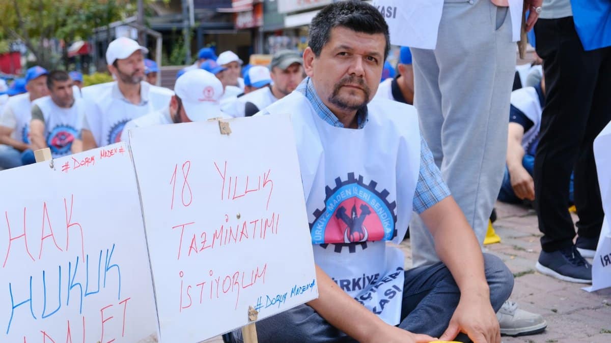 Miners protesting for their rights and compensation in a peaceful protest.