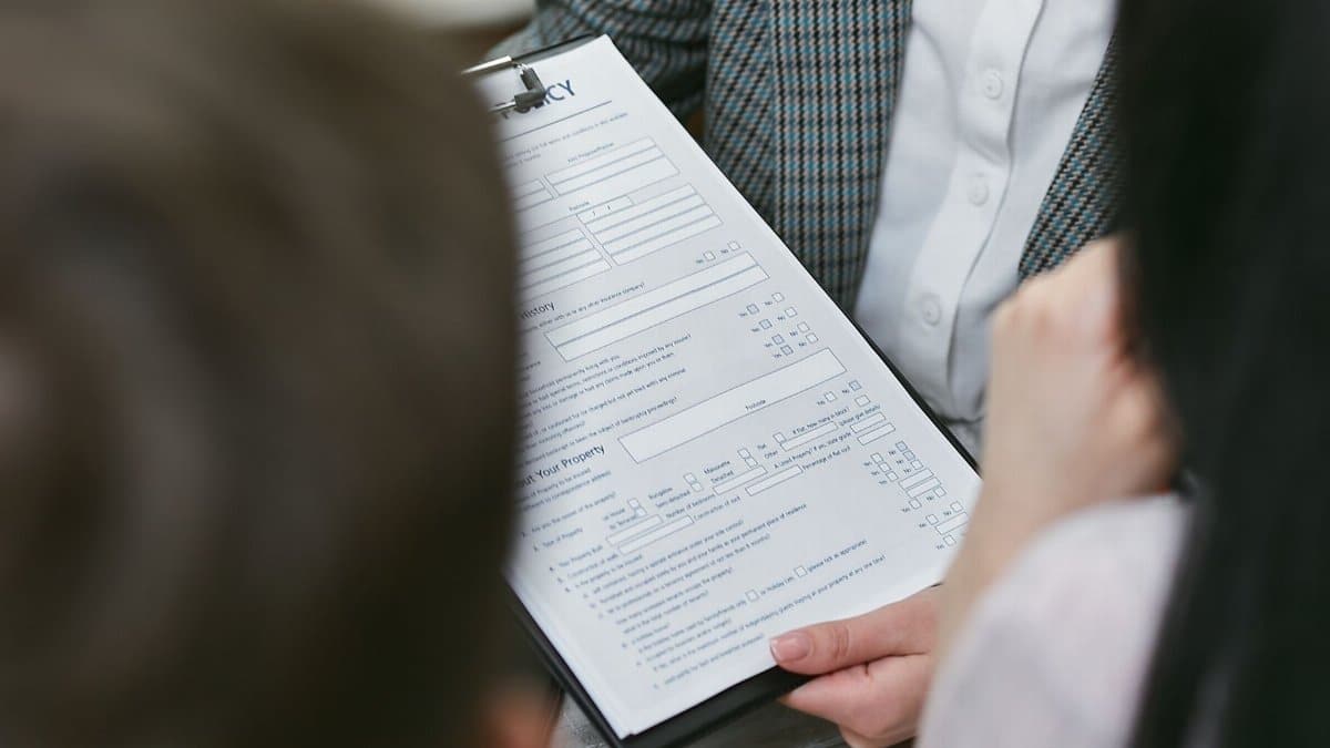 Close-up of professionals discussing a legal contract during a business meeting.