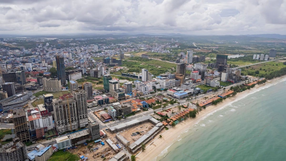 Expansive aerial view capturing Sihanoukville's cityscape and coastline in Cambodia.