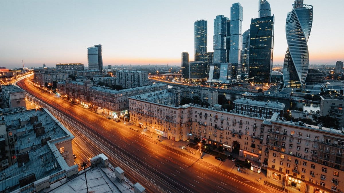Aerial view of Moscow's skyscrapers and urban skyline during twilight, showcasing modern architecture.
