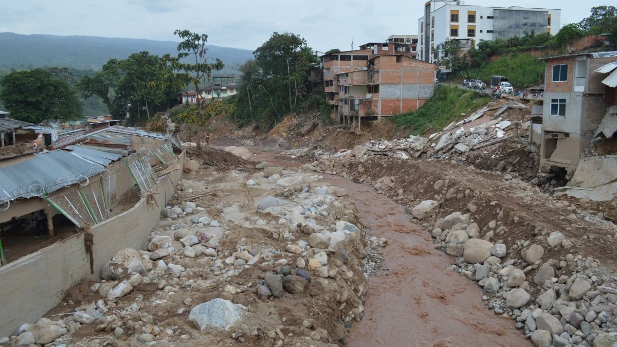 Destruction in Mocoa, Colombia due to a severe mudslide with debris and damaged buildings.