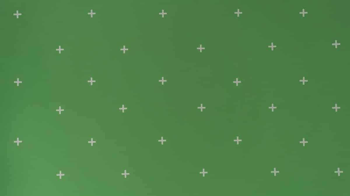Green screen with white cross markers used for visual effects and post-production.