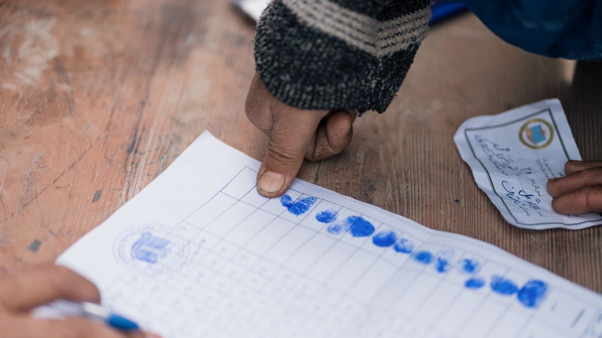 Close-up of fingerprint marking on a voting document in Afghanistan, showing election authentication.