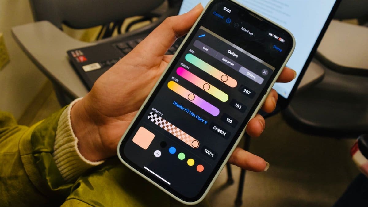 A person browsing a color selection app on a smartphone screen indoors with visible color options.