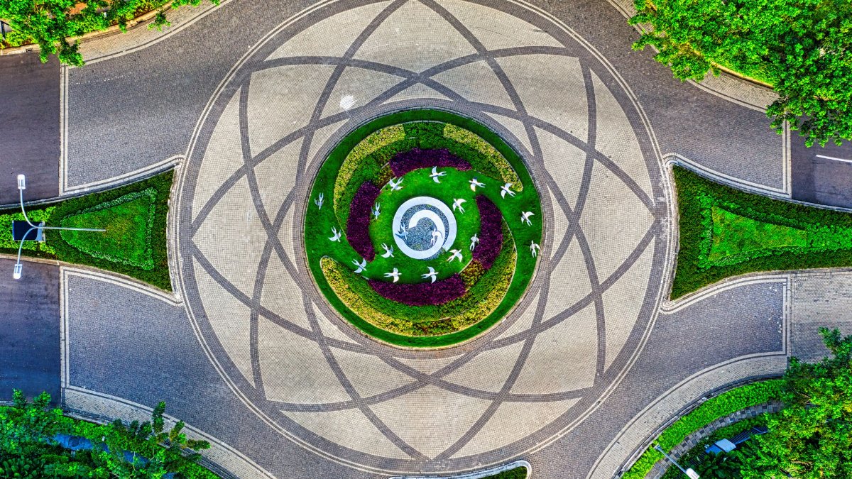 Stunning aerial view of a landscaped roundabout in Banten, Indonesia, with intricate patterns.