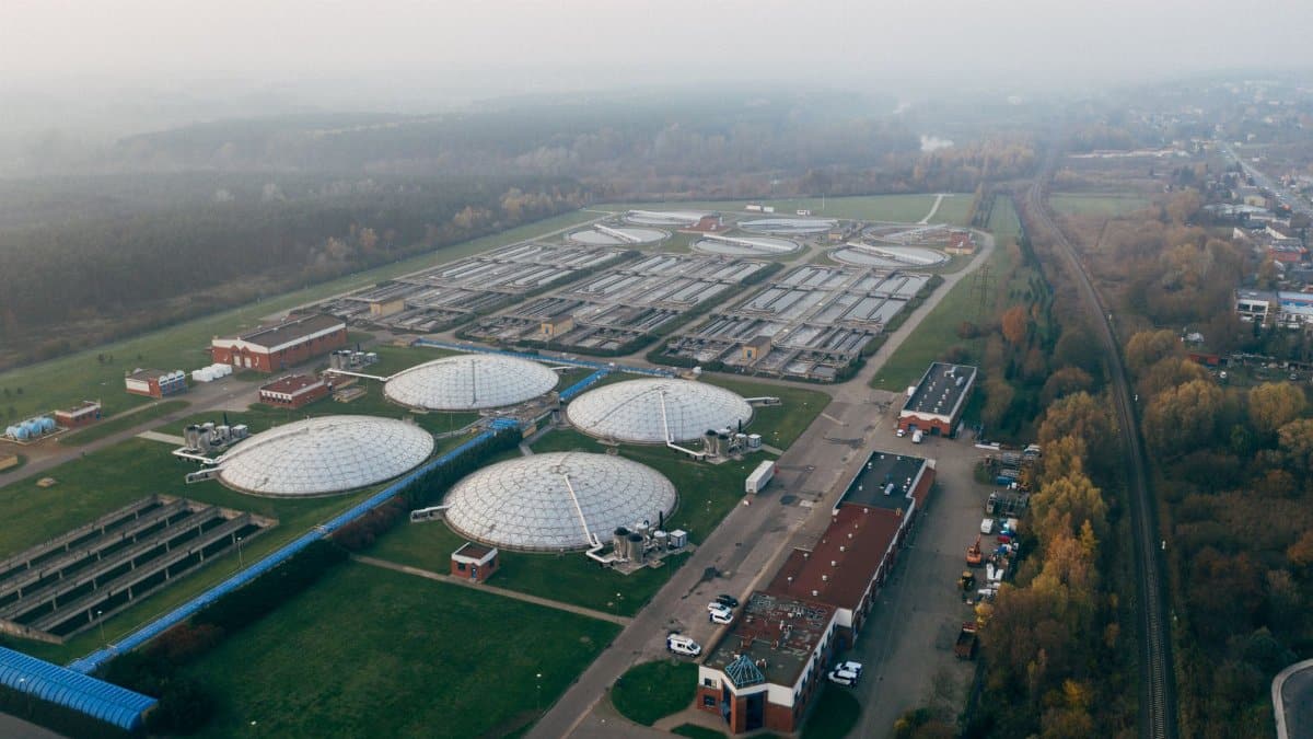Aerial shot of a wastewater treatment facility in Poznań, showcasing industrial technology and environmental effort.
