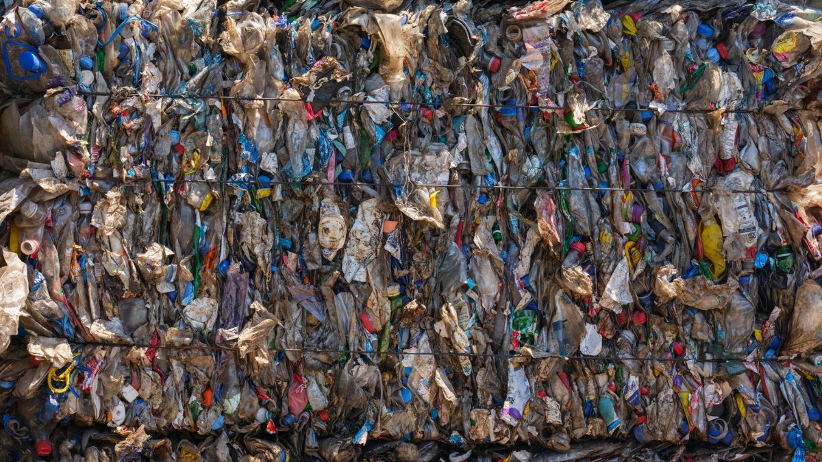 Baled plastic waste ready for recycling, highlighting environmental protection efforts.