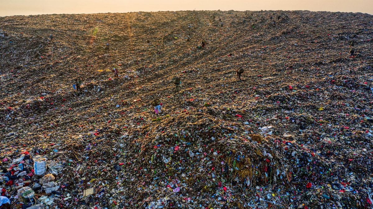 Drone shot of a massive landfill highlighting environmental pollution in West Java, Indonesia.