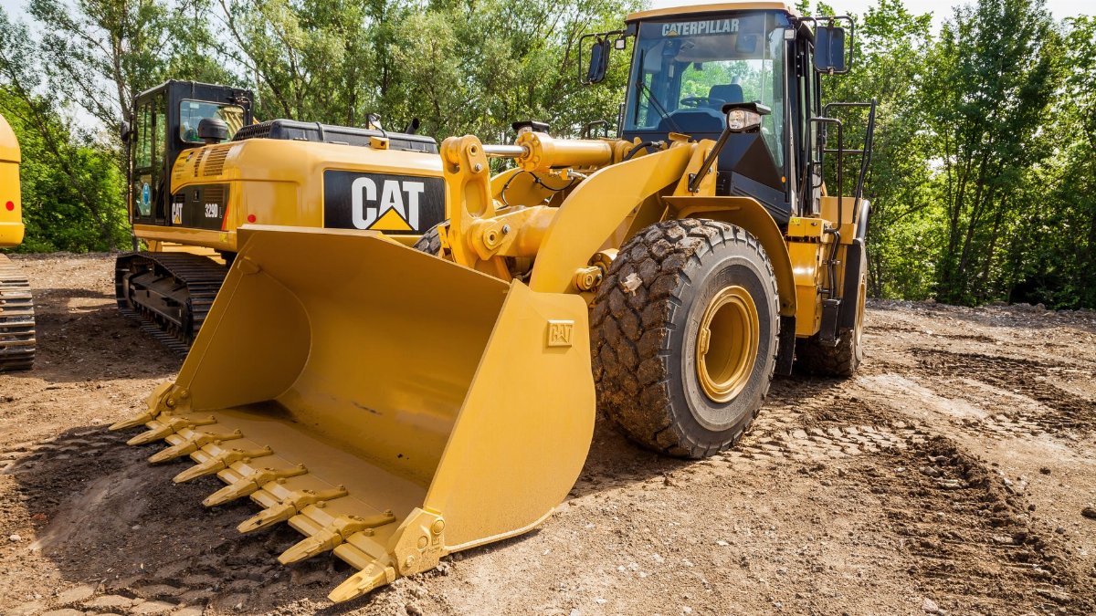 Yellow construction equipment in operation at Kyiv site, showcasing industrial strength.