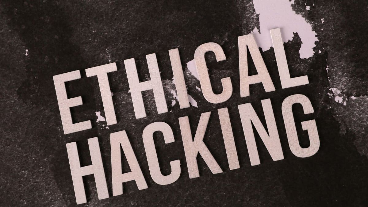 Creative depiction of the term 'Ethical Hacking' on a dark artistic background.